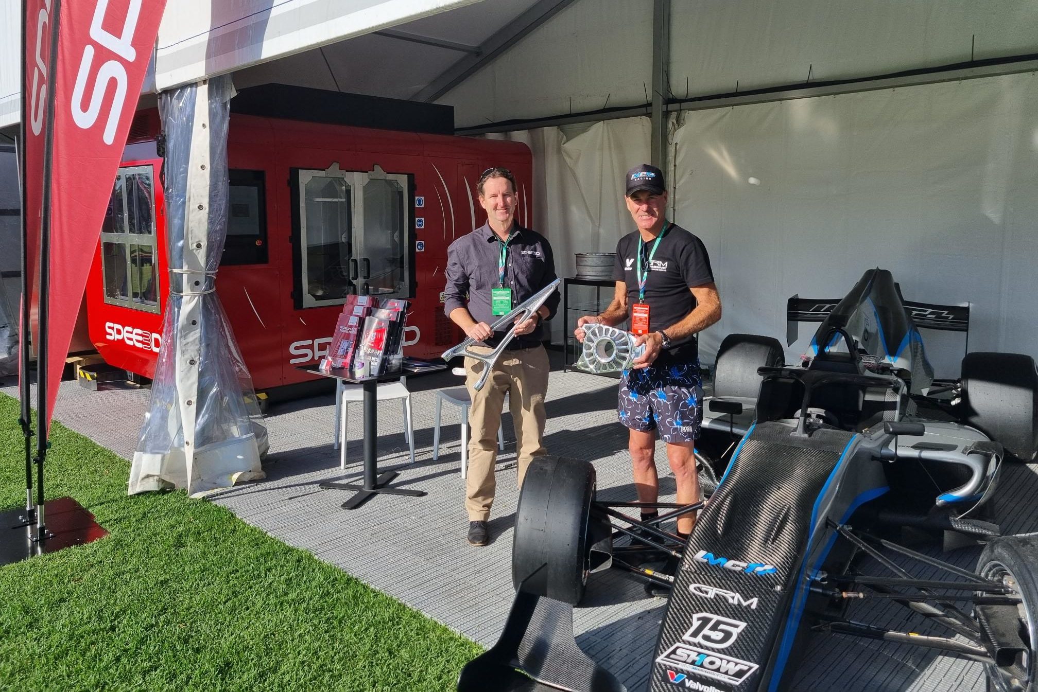 Byron Kennedy and Barry Richards from GRMotorSports holding SPEE3D printed s5000 parts