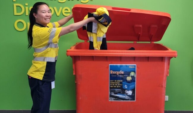 Opal team filling 660 litre uniform collection bin